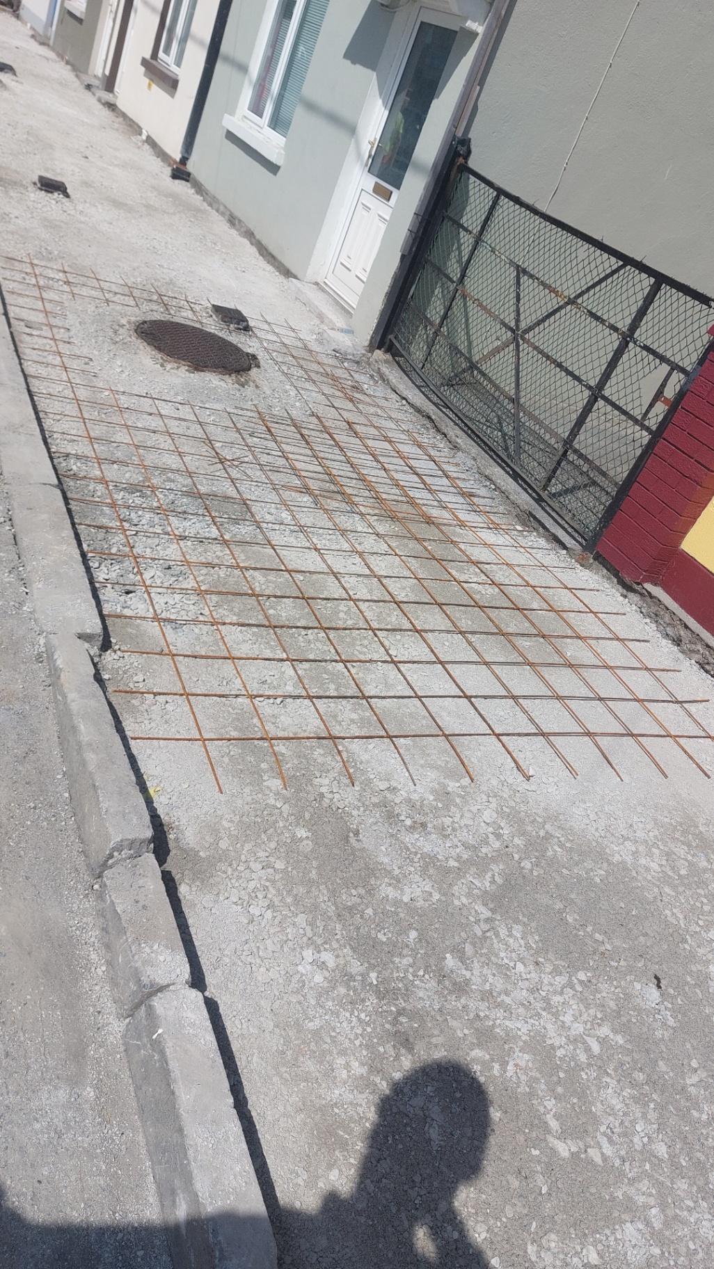 Steel mesh reinforcement ready for a concrete footpath pour